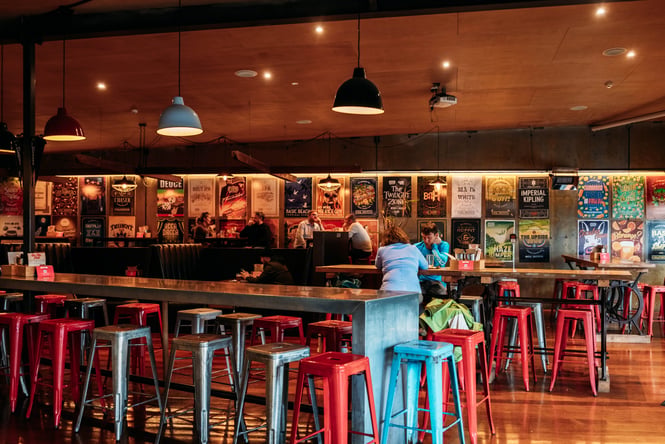 Long tables with customers sitting at them at Fork & Brewer.