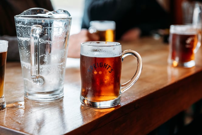 A close up of a beer on a table.
