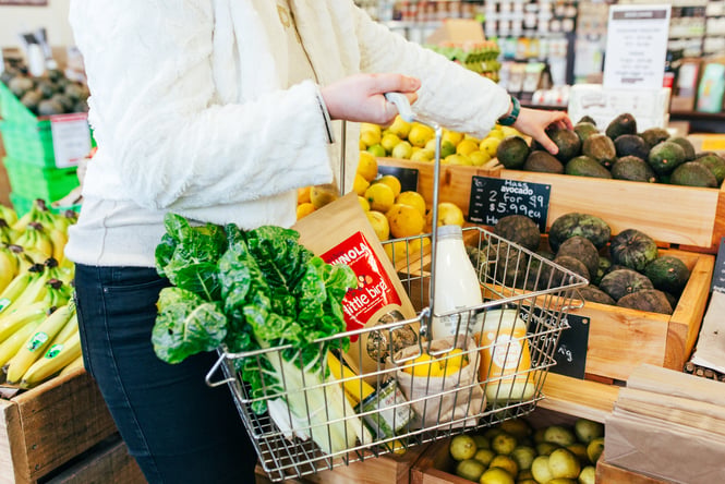 Customer filling their basket at Commonsense Organics.