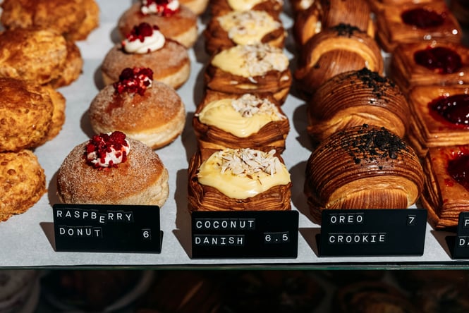 Line up of pastries in the cabinet at Völco.