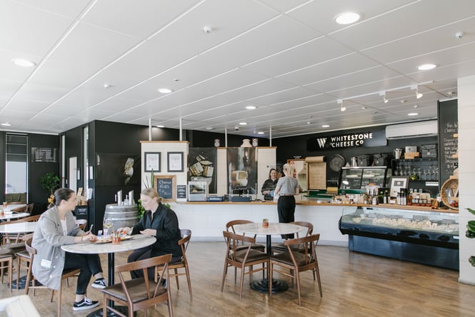 A wide view of the Whitestone Cheese Co.'s deli and cafe interior.