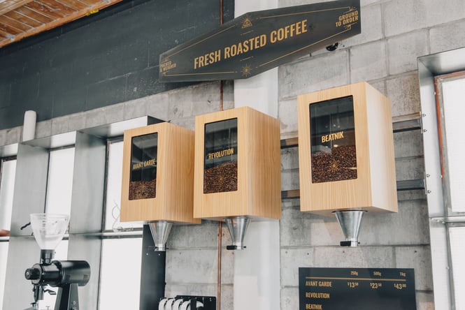 Freshly roasted coffee on display in boxes.
