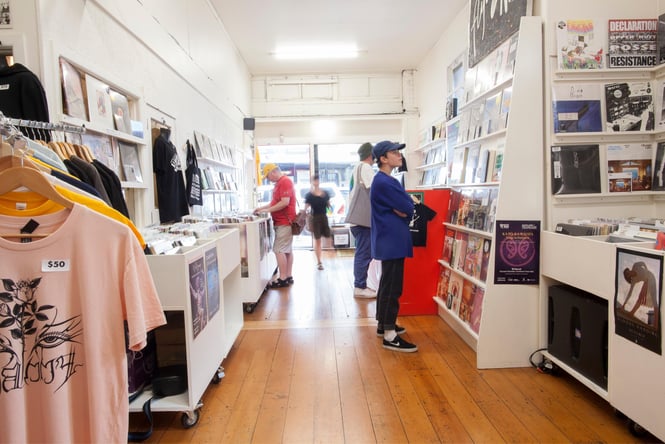 People browsing the Flying Out shop.