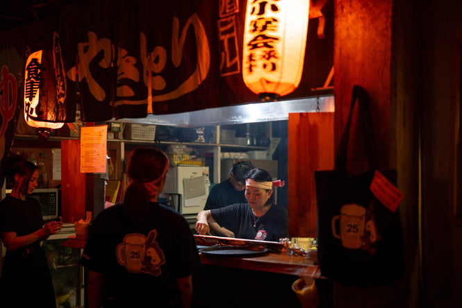 Staff members working in the steamy kitchen.