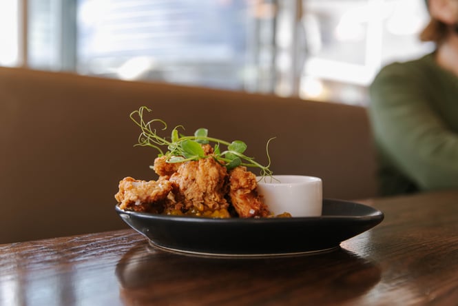 A plate of fried chicken on a table.