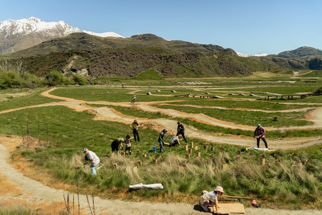 Bikers in the grounds at Bike Glendhu planting trees.
