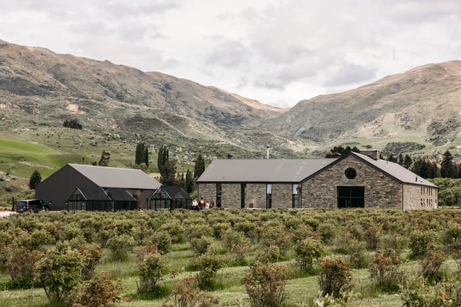 Exterior view of the Cardrona Distillery building against the beautiful landscape.