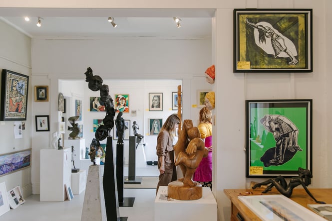 Woman browsing inside York Street Gallery of Fine Art, Timaru.