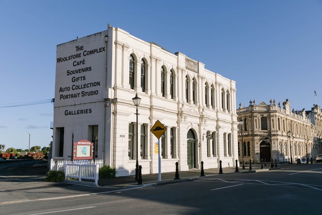 The sun shining down on a limestone building.