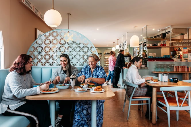 Diners enjoying their lunch at Whitestone Cheese Deli & Diner.