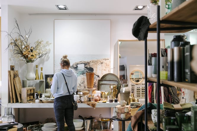 Woman looking at homewares at Addy & Lou.