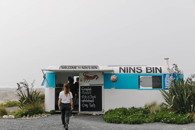 Customer ordering at Nin's Bin.
