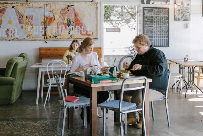 Couple eating at a table at Slam Club.