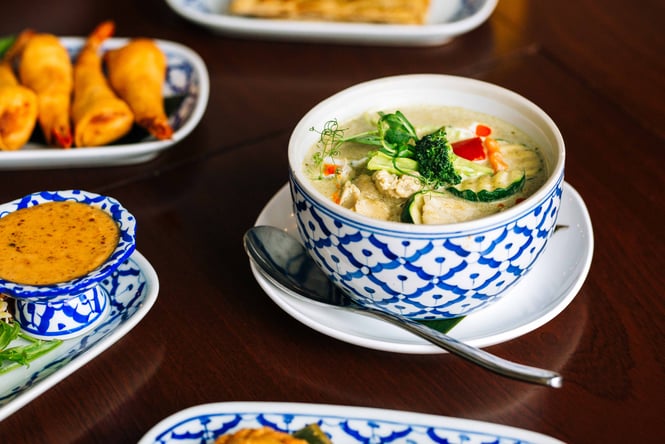 Close up of thai green curry and other dishes from Tuk Tuk Thai.