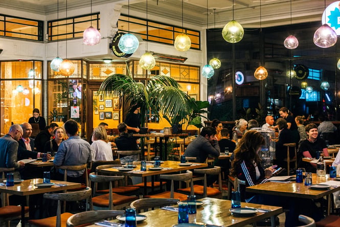 People having dinner at Gemmayze Street in the atrium of St Kevins Arcade