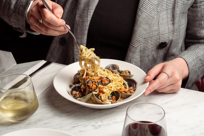 A plate of seafood pasta on a table.