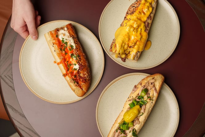 Three plates of cheese bread.