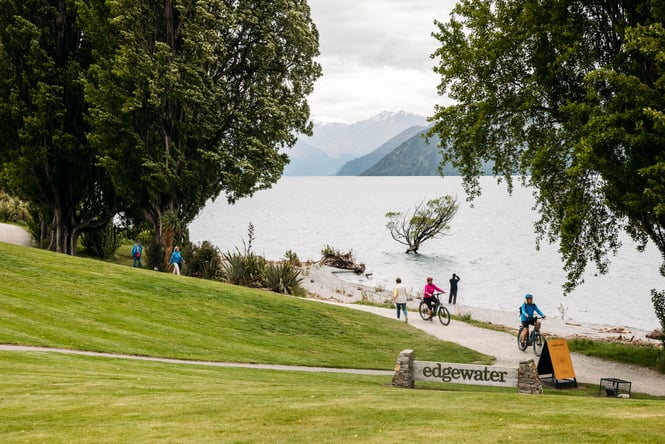 People being alongside the lakefront.