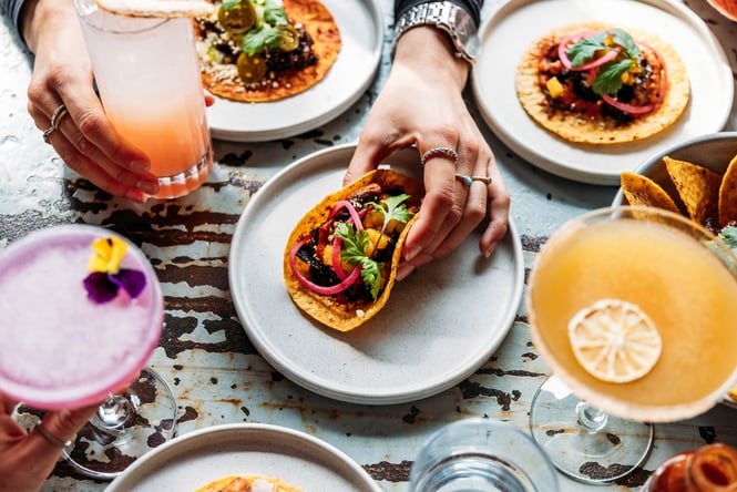 Tacos and cocktails on the table at Paloma.