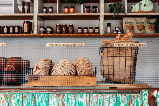 Loaves of bread in baskets on the counter at The Baked Dane.