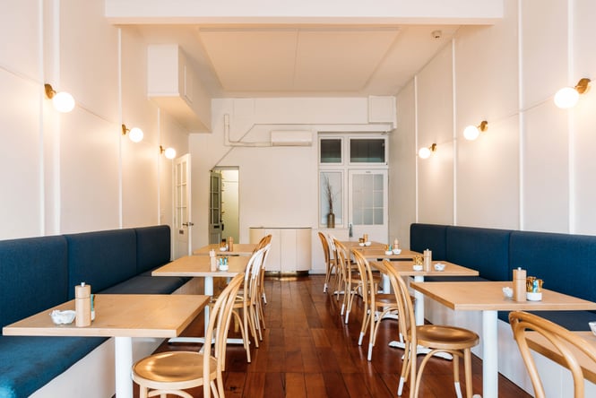 The blue and white interior of Comes & Goes cafe in Petone.