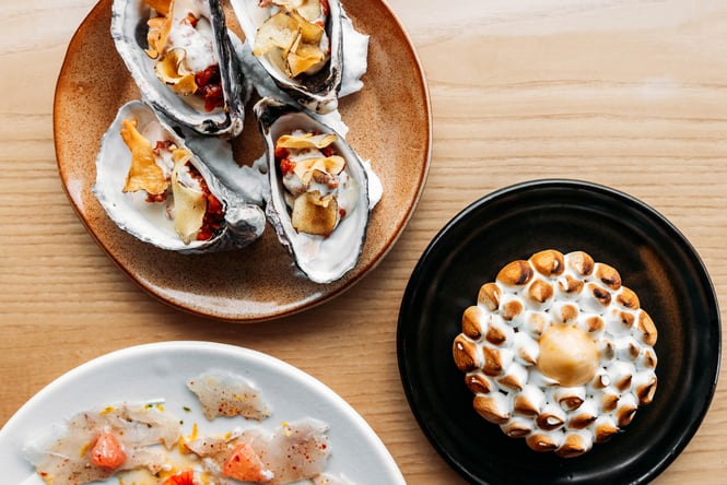 Plates of food on the table at Supra.