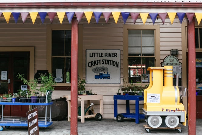 Close up of Little River Craft Station building with plants outside