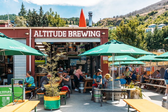 Customers sitting at outdoor tables at Altitude.