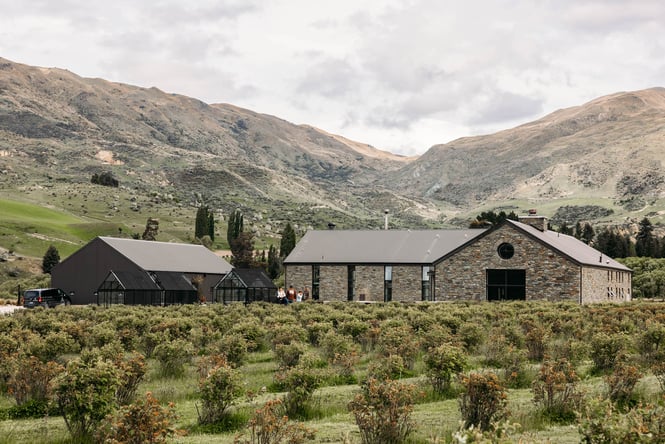 Exterior of Cardrona Distillery with mountains in the background