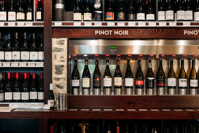 Bottles of wine lined up at The Winery.