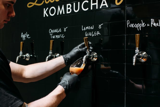 The refill taps and station at Little City Kombucha.