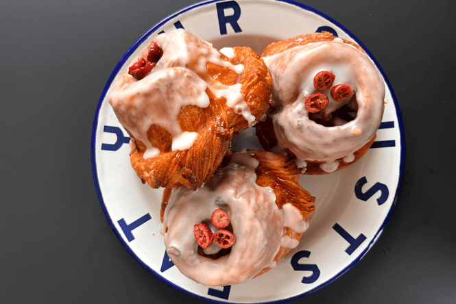 Christmas morning buns on a blue and white plate.