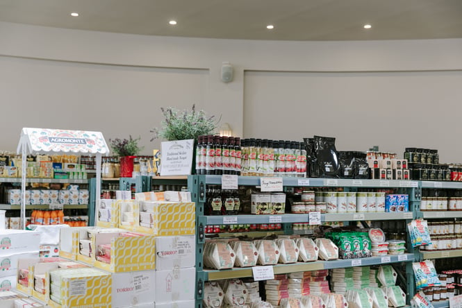 Italian food items on display on shelves inside Mediterranean Food Company..