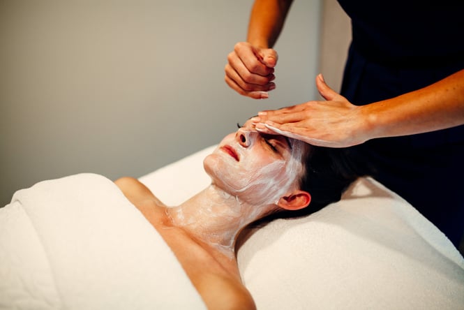Woman getting a facial at Renaissance spa