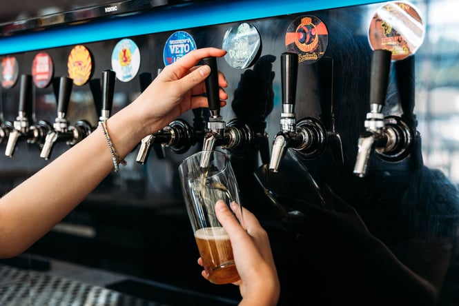A beer being poured into a glass.