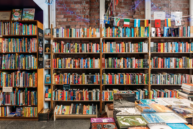 Books lined up on shelves inside Schrödinger’s Books in Petone.