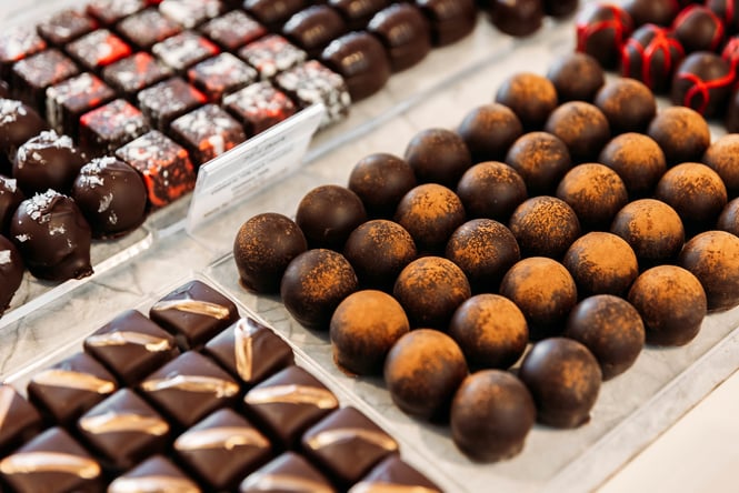 Close up of rows of chocolate truffles.
