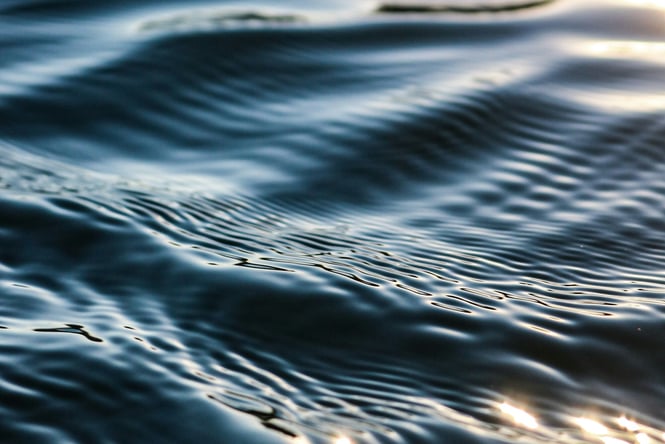 Close up of ripples on water surface.