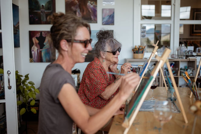 Two women painting.
