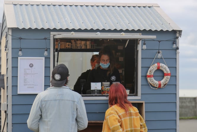 Sam and caroline outside North Beach Coffee Shed in New Brighton.