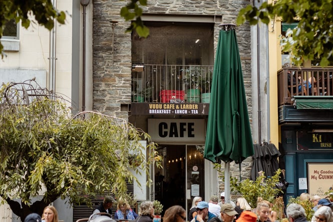 People dining outside a cafe.