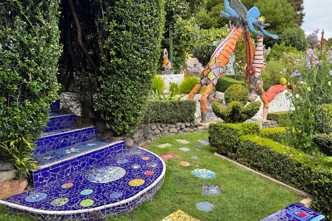 Sculpture garden at Giants House in Akaroa with mosaic artwork amongst the plants