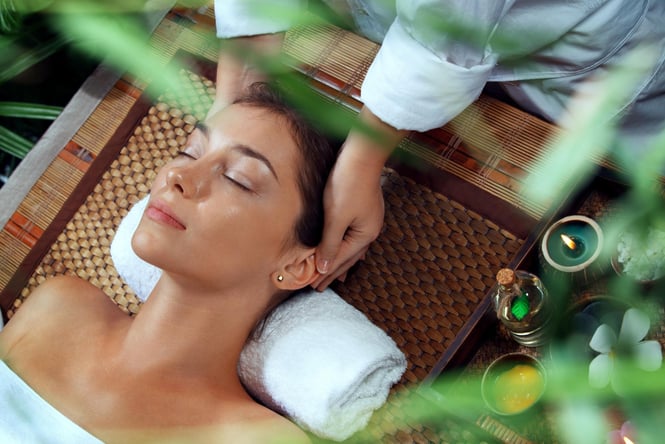 A woman receiving a spa treatment.