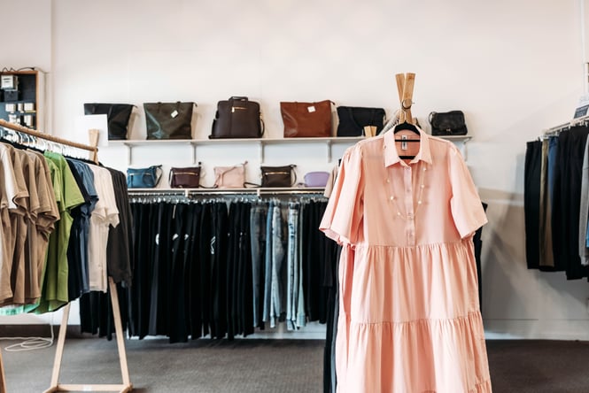Clothes hanging on a rack at Pink Lemonade.