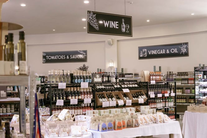 Shelves in the wine and grocery sections of Mediterranean Foods.
