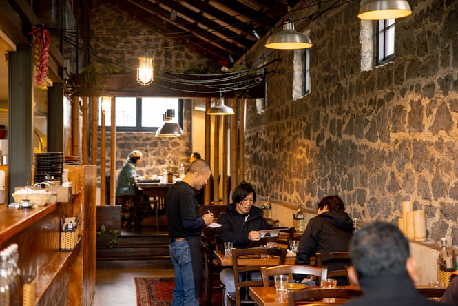 Customers dining inside Sen Kitchen in Auckland.