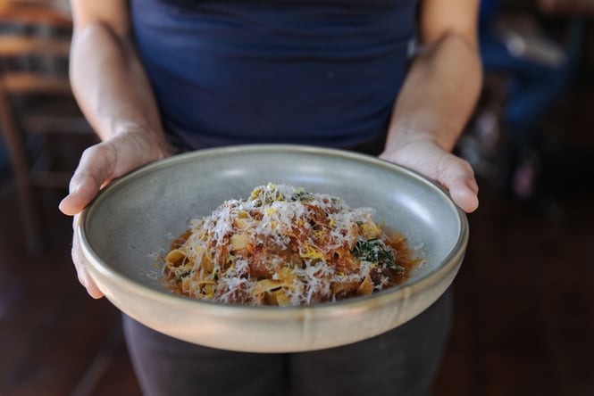 Close up of Italian pasta dish with grated parmesan on top