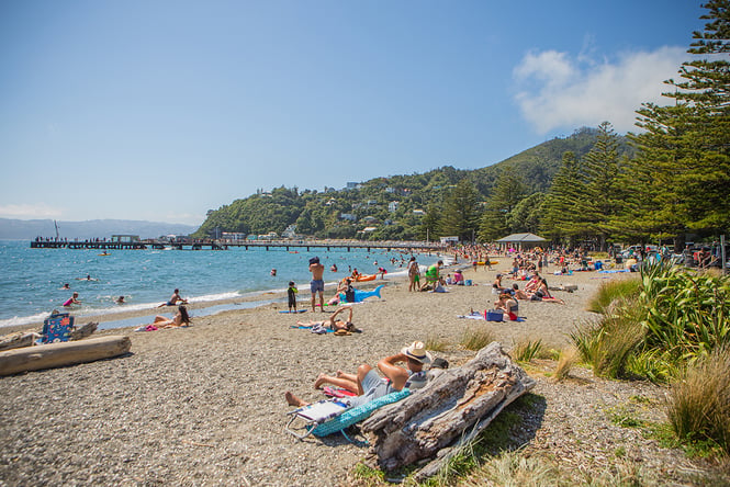 People on a beach on a sunny day.
