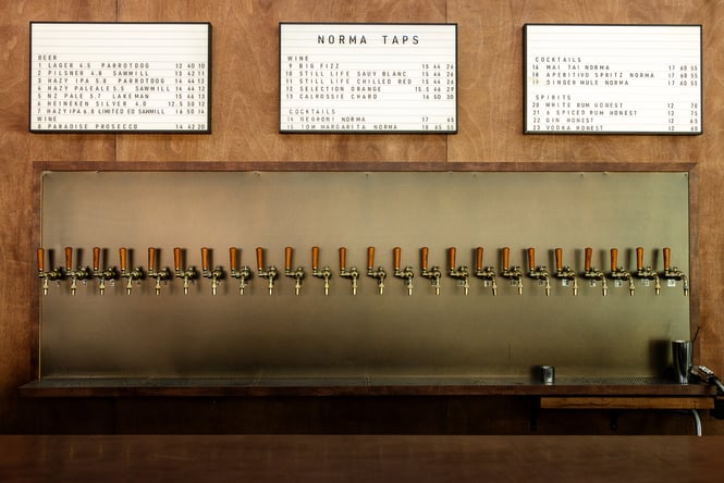 Close up of drinks menu and taps at Norma Taps in Auckland
