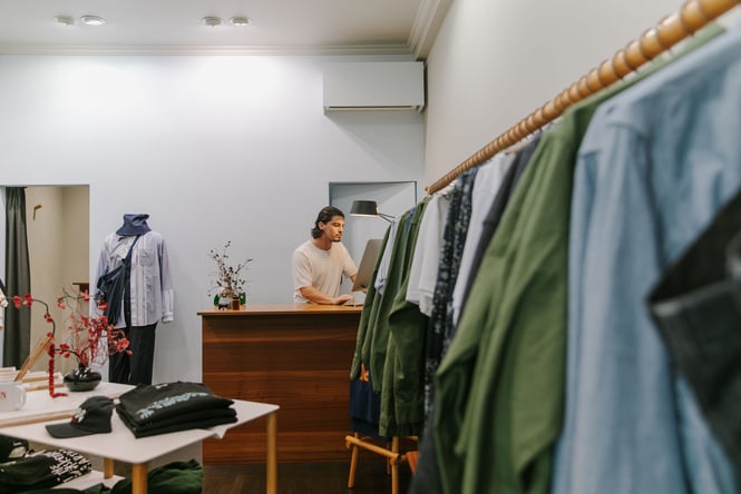 Clothing on display on racks at Shakes.